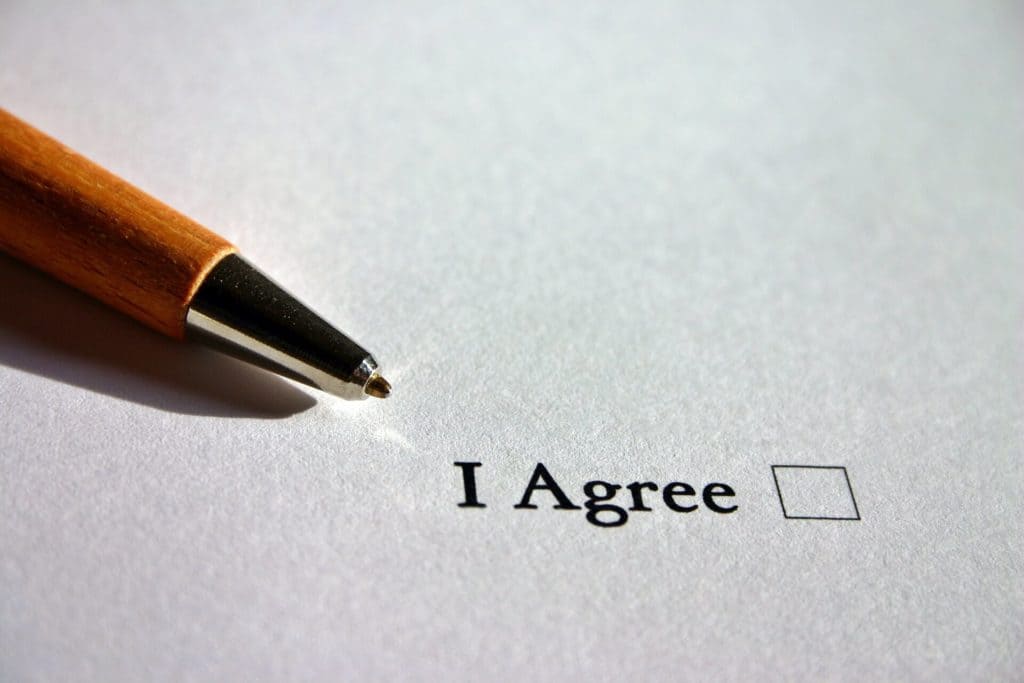A pen with a checkbox labelled "I Agree".